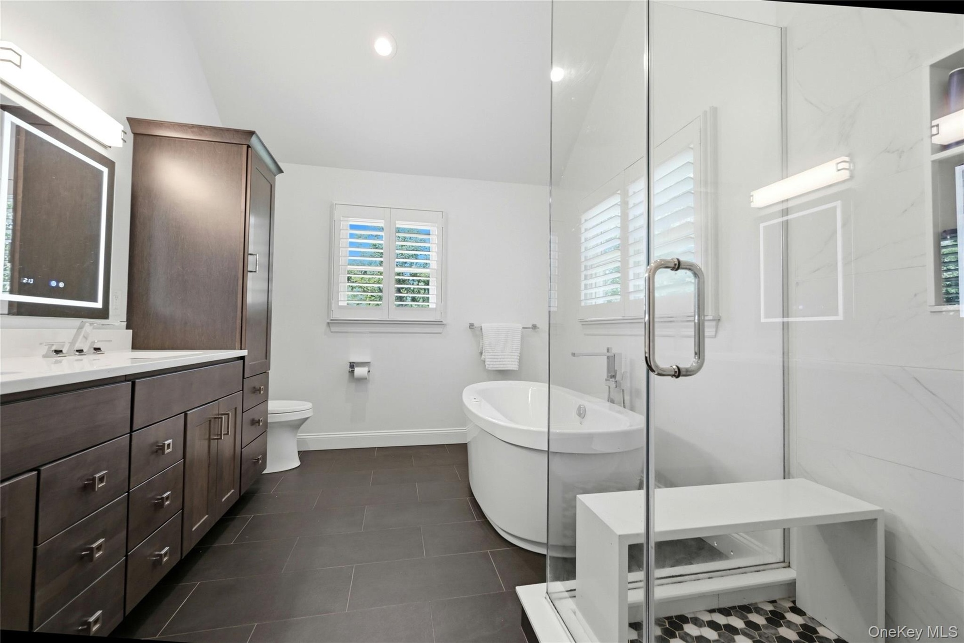 Generous double vanity with Smart mirrors