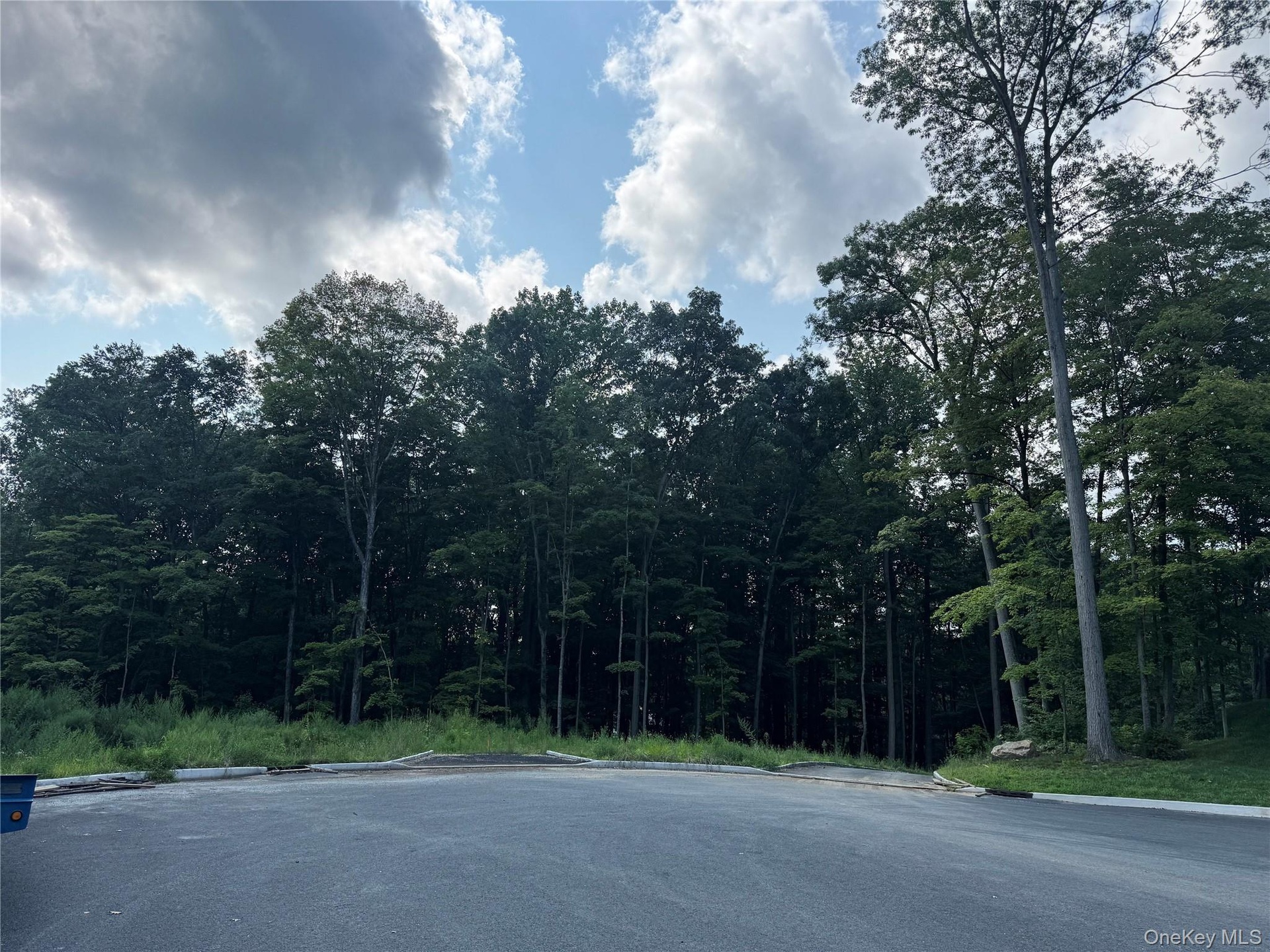 A private road welcomes you into an exclusive four-home cul-de-sac