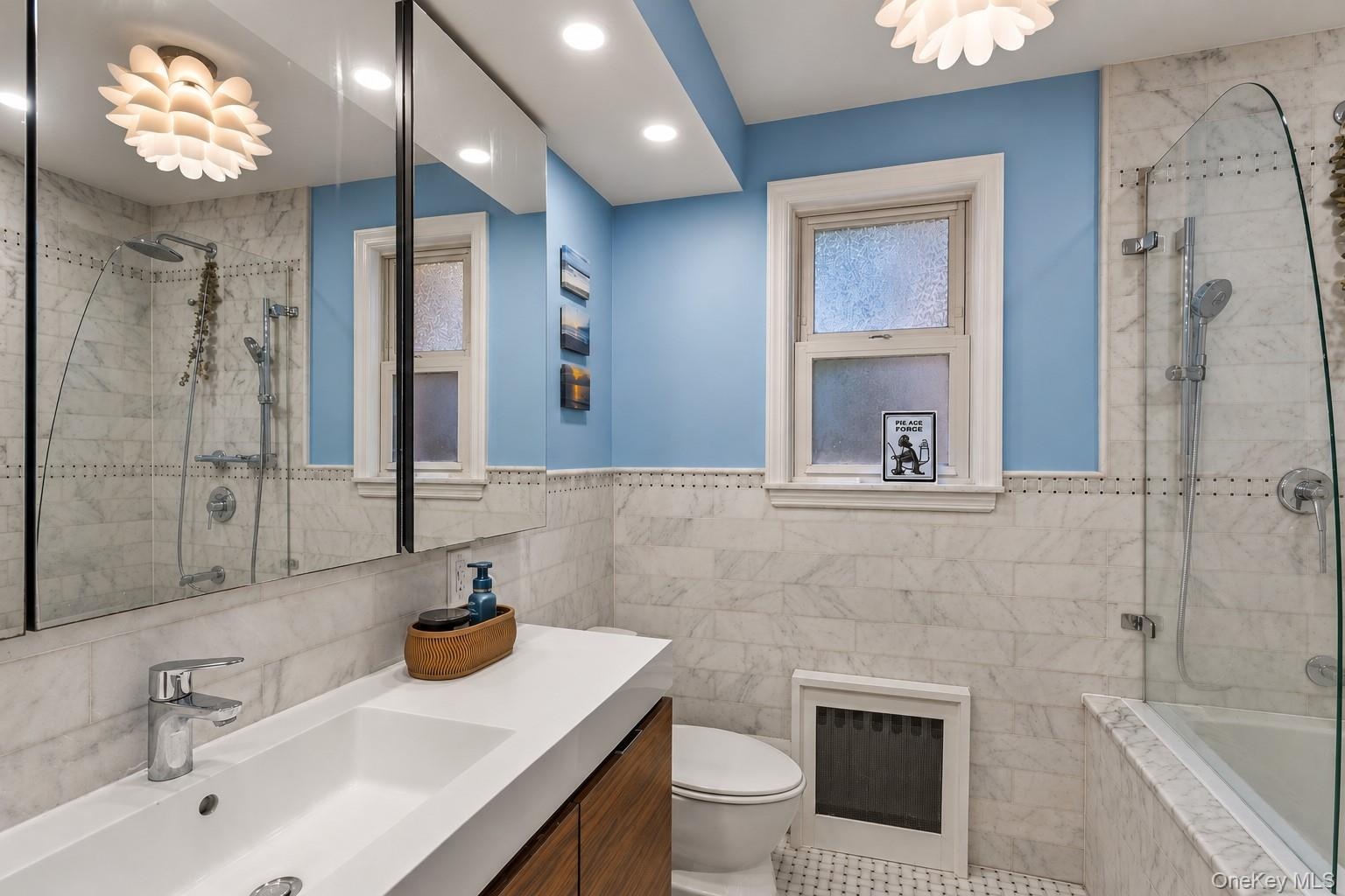 Marble bathroom w glass shower door