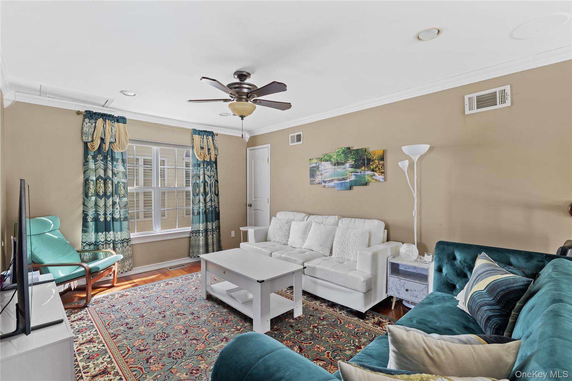 Hardwood-finish flooring, crown molding, and recessed lighting