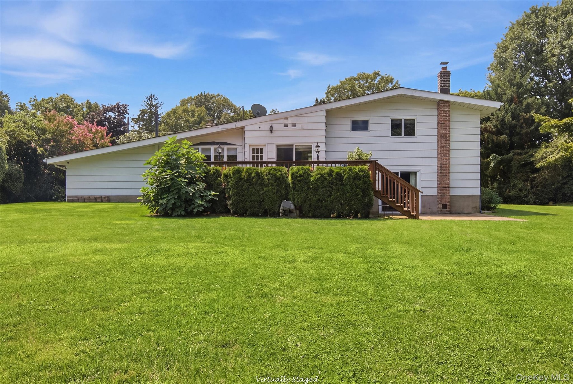Expansive grounds with mature landscaping and lush lawn