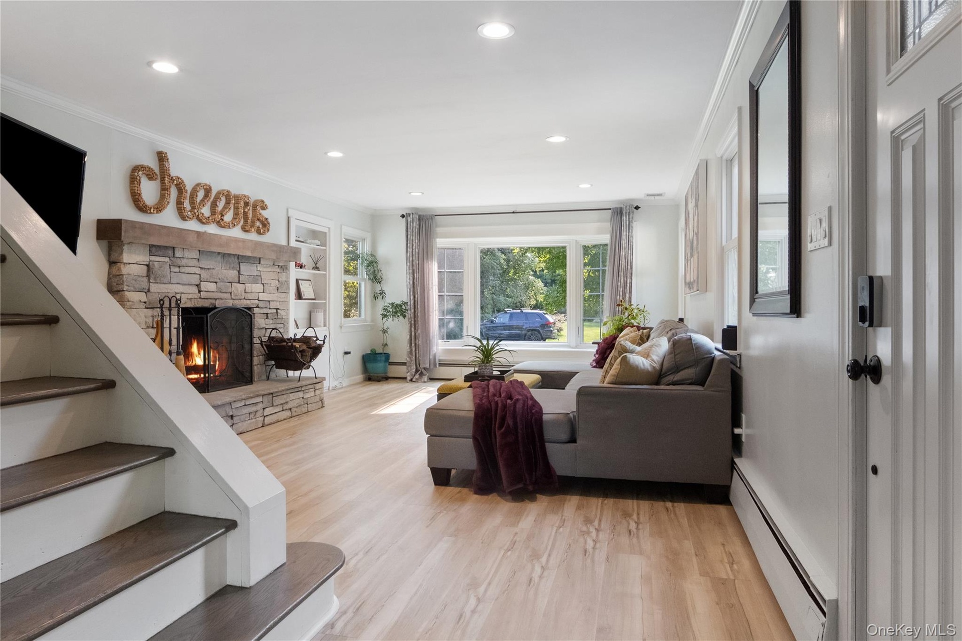 Welcome Home. Curl up in front of the wood-burning cultured stone fireplace. The bay window offers views of the front flower garden where you can watc
