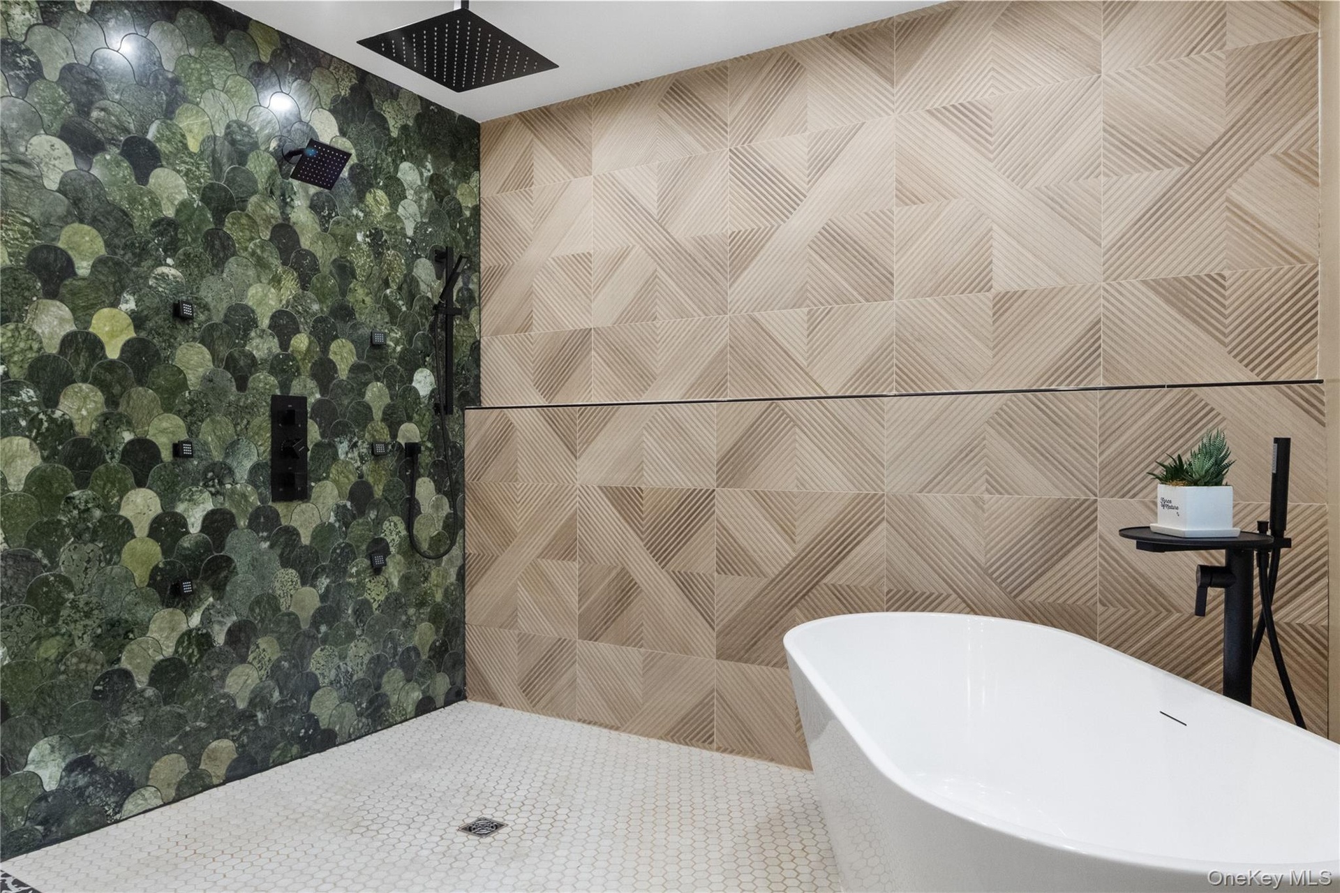 You never have to worry about the floor getting wet in this bathroom. In fact, it's encouraged. Suds in the tub and rinse in the shower.