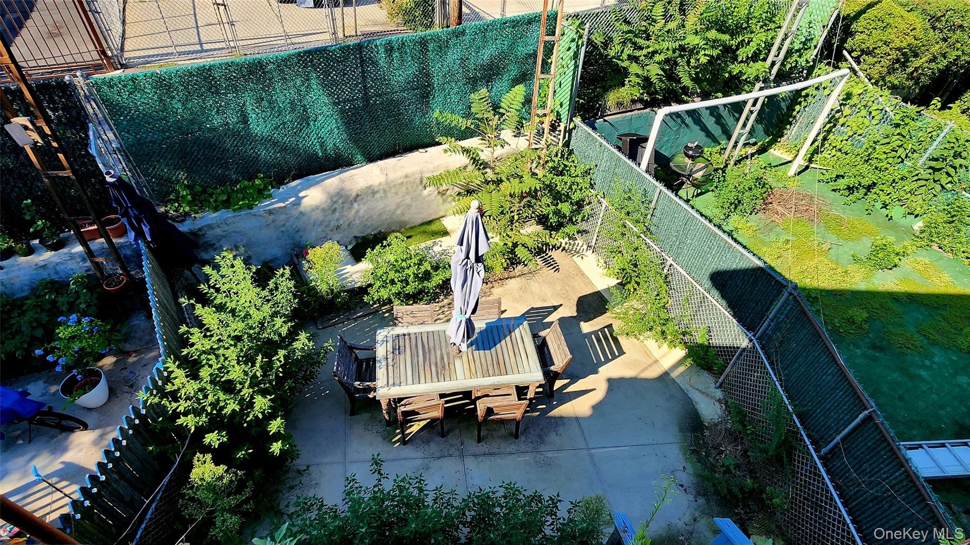 View of backyard from second floor balcony