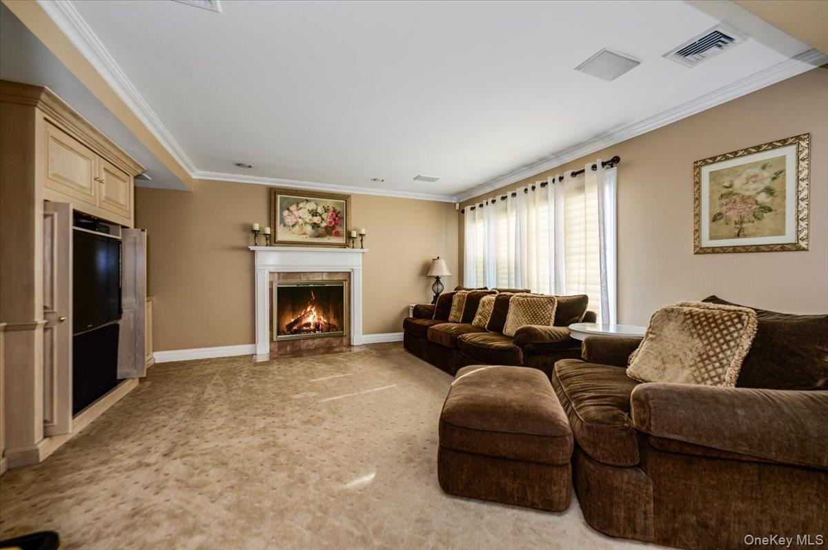 Spacious Entertainment Room with Fireplace
