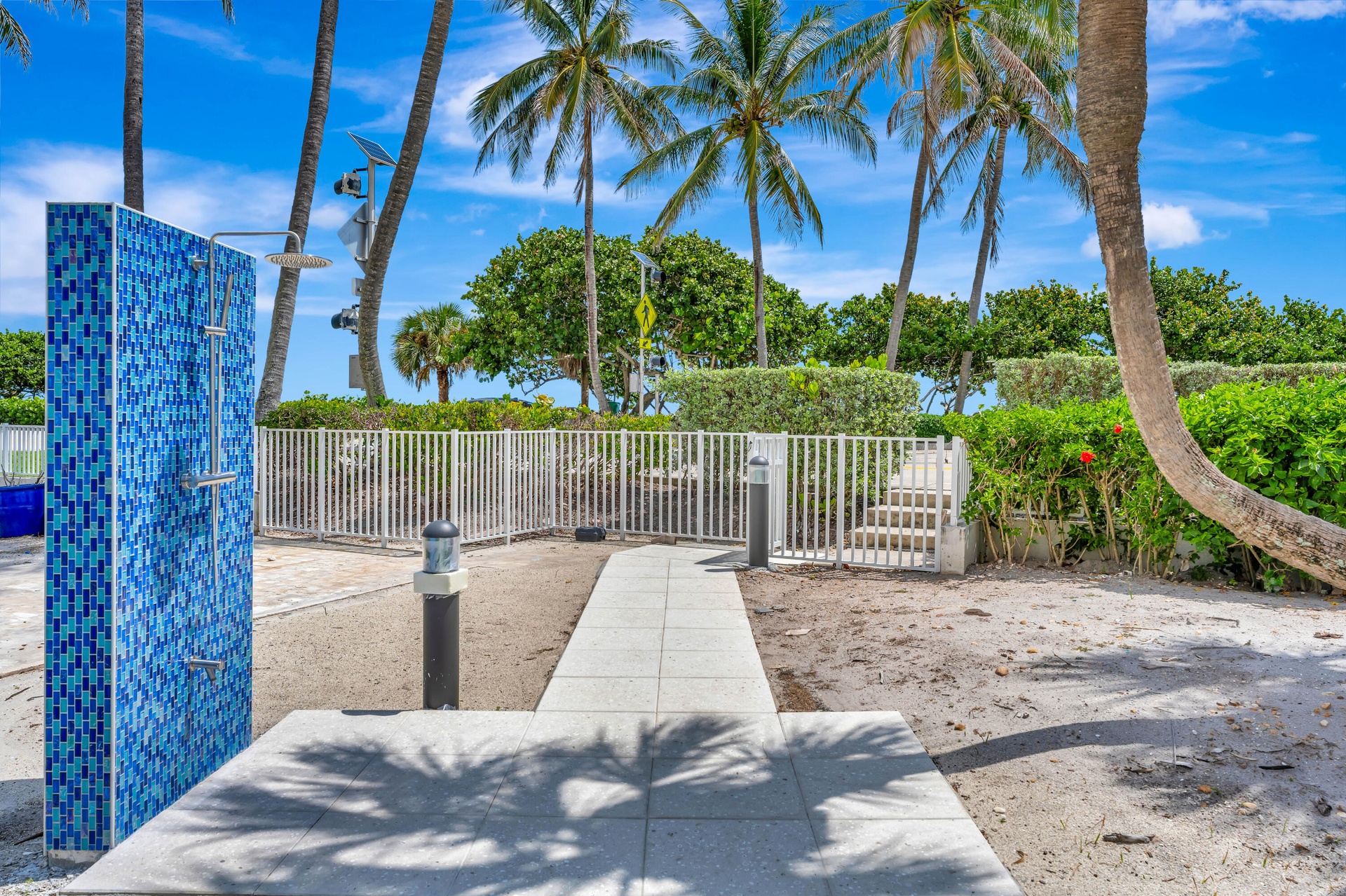 Second outdoor shower and pathway leading direct to Beach Access #48 and Jupiter's beautiful turquoise-blue waters and pristine shoreline. Estimated t