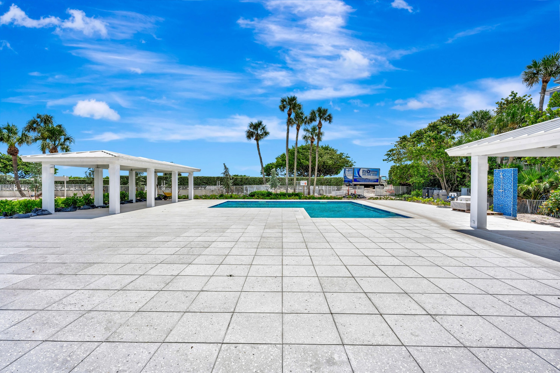 Beautifully renovated pool area featuring an outdoor kitchen, open-air cabanas and convenient outdoor showers. The perfect setting for relaxing, enter