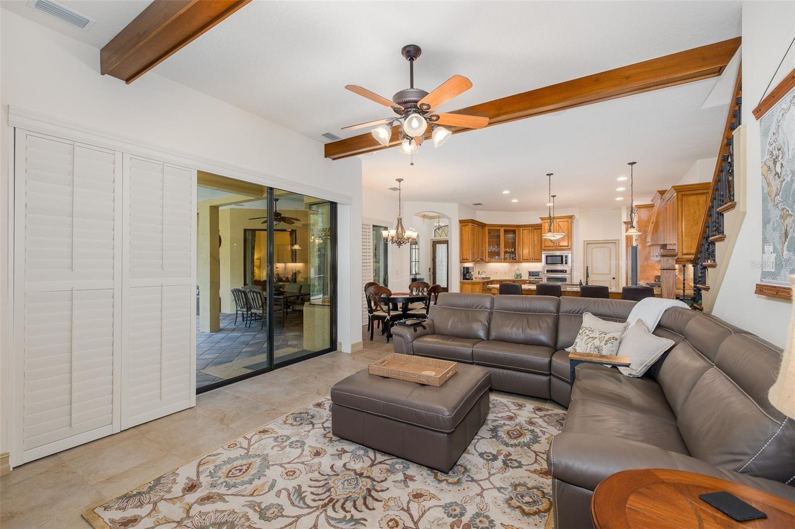 Family Room with wood beamed ceiling accents