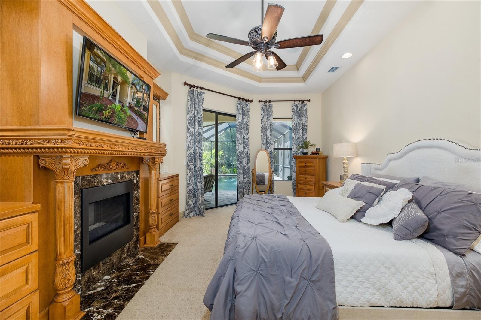 Primary Bedroom with custom gas fireplace