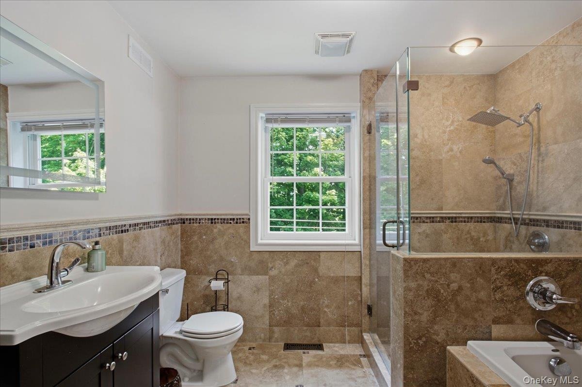 Full Bath with Jacuzzi tub and separate shower on 1st level