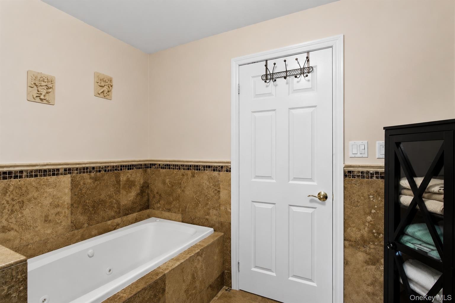 Full Bath with Jacuzzi tub and separate shower on 1st level