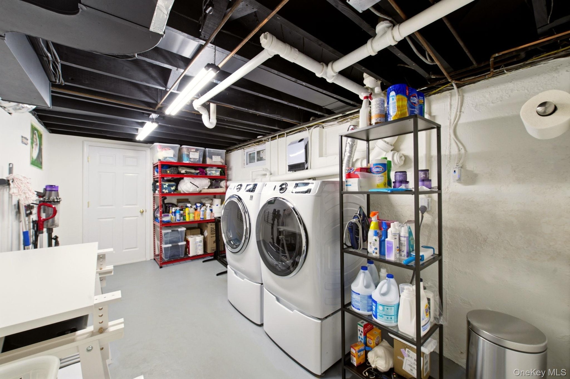 Spacious Laundry Room with Laundry Shoot & Storage