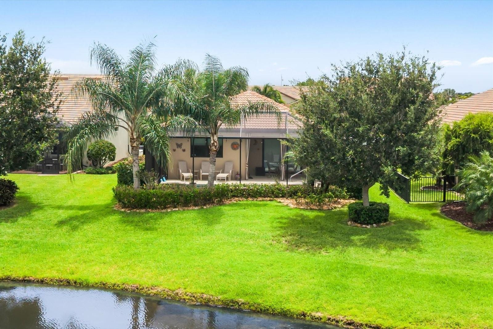 Lush, Landscaped Backyard with a Private Screened Pool