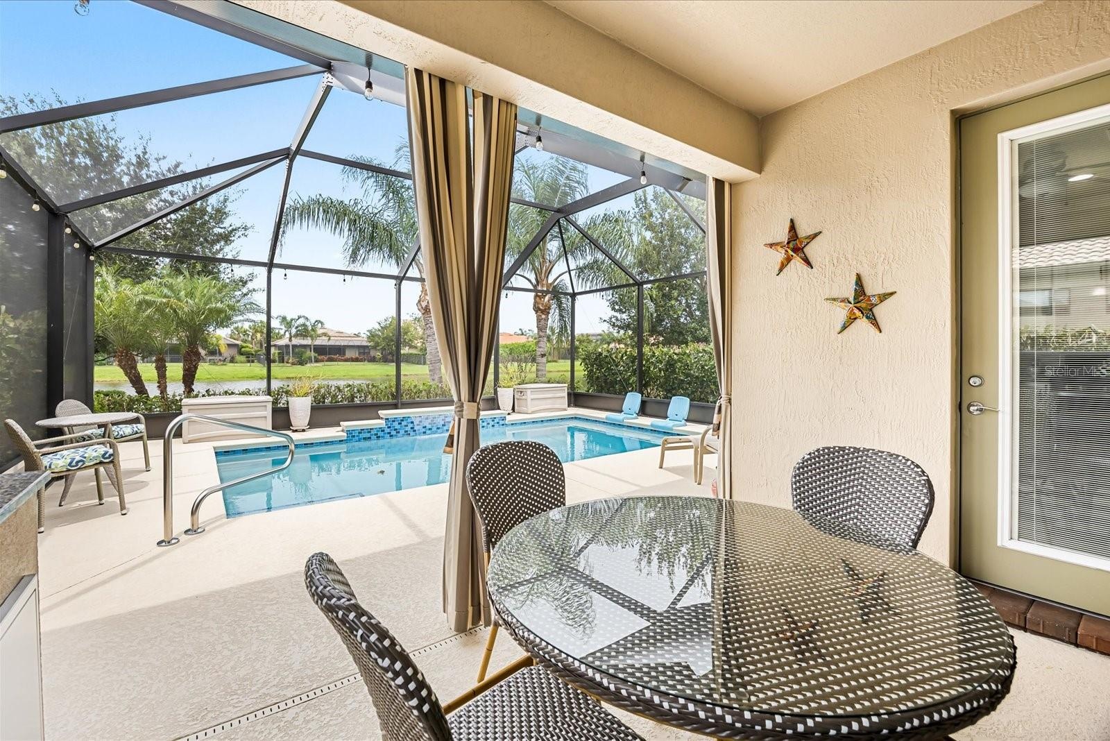 Covered Lanai Overlooking the Pool and Peaceful Pond Views