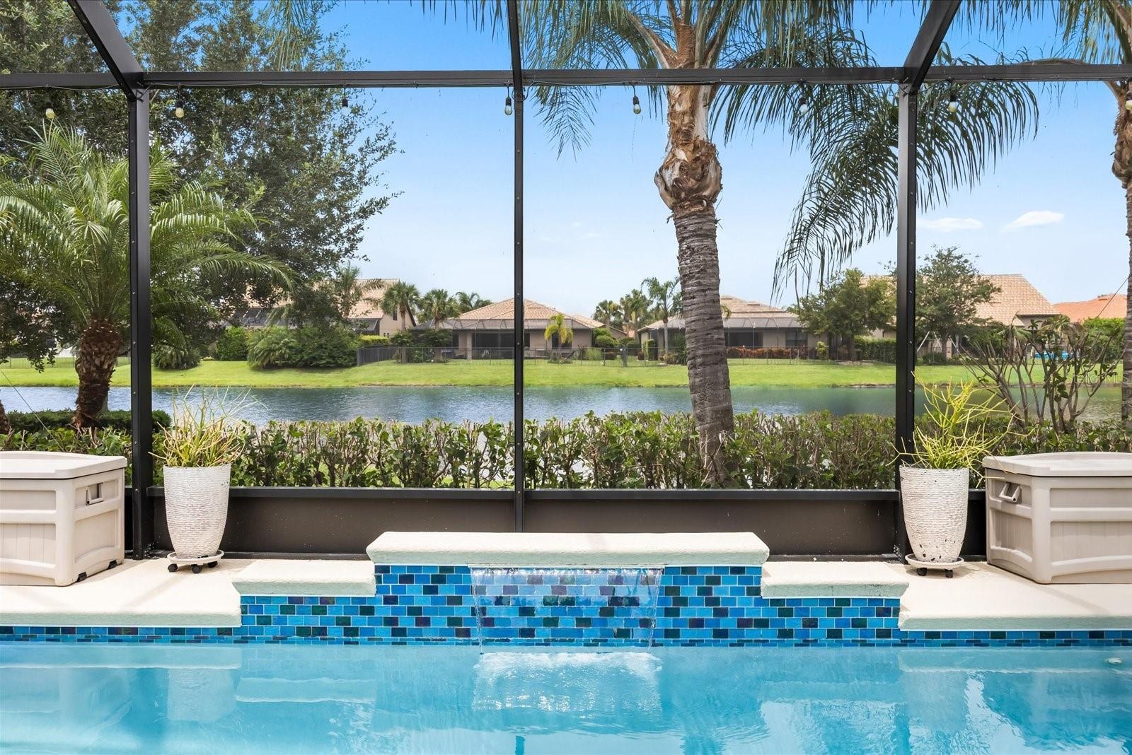 Poolside Waterfall with Peaceful Pond Views
