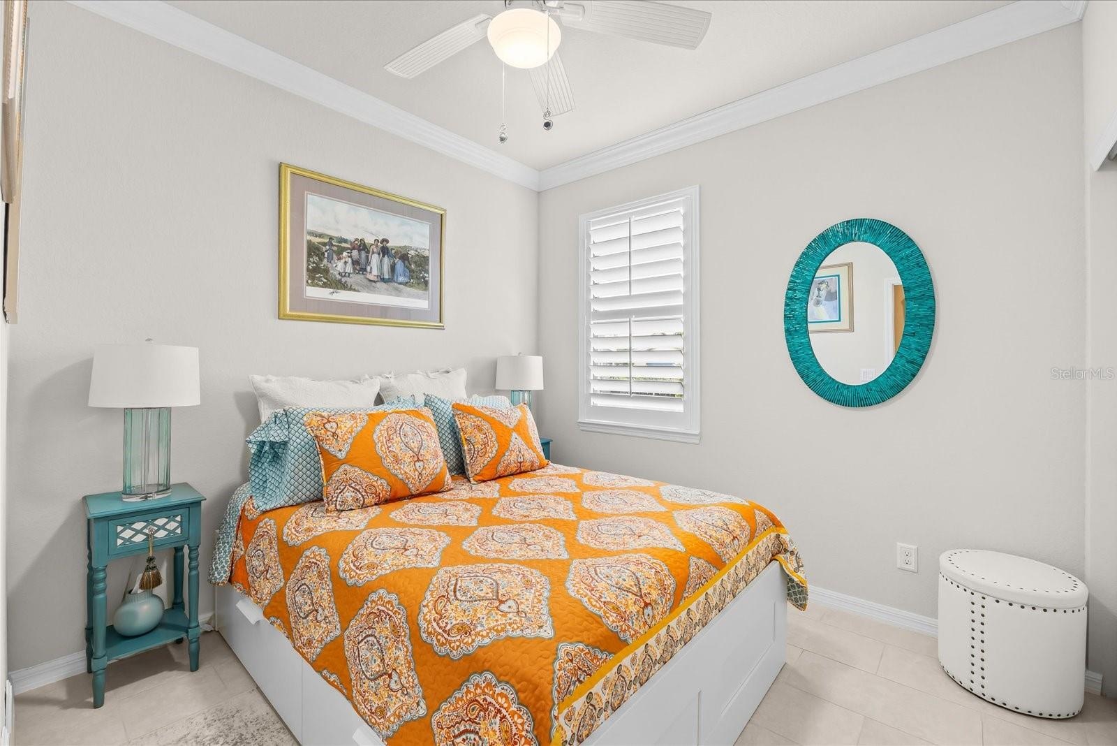 Guess Bedroom Featuring a Coffered Ceiling and Crown Molding