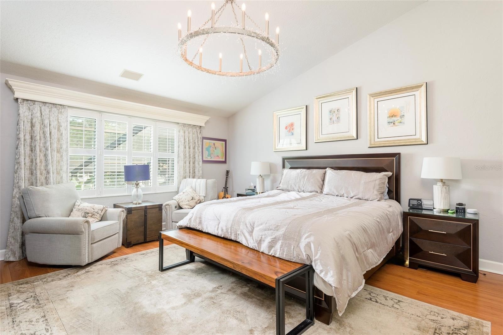 Primary bedroom, crown molding curtain insert, wood flooring