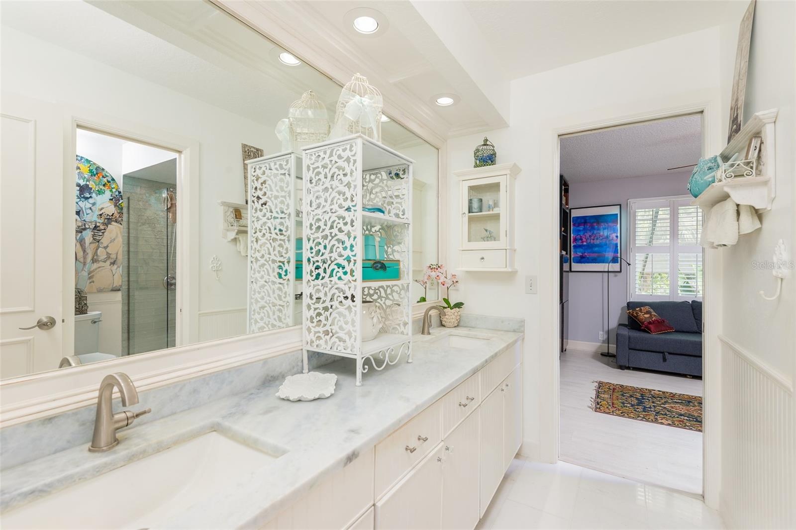 Remodeled Jack and Jill bath, double sinks, quartz counter top and marble flooring