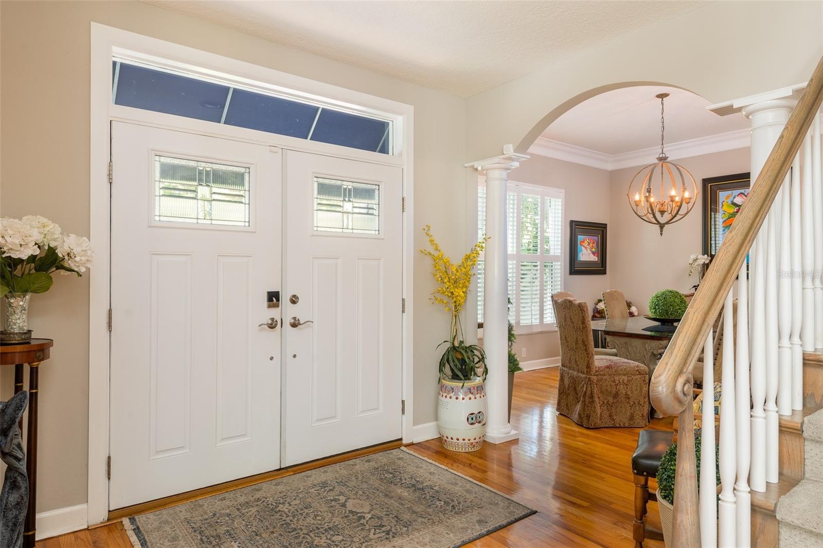Entry foyer with partial view of formal dining room