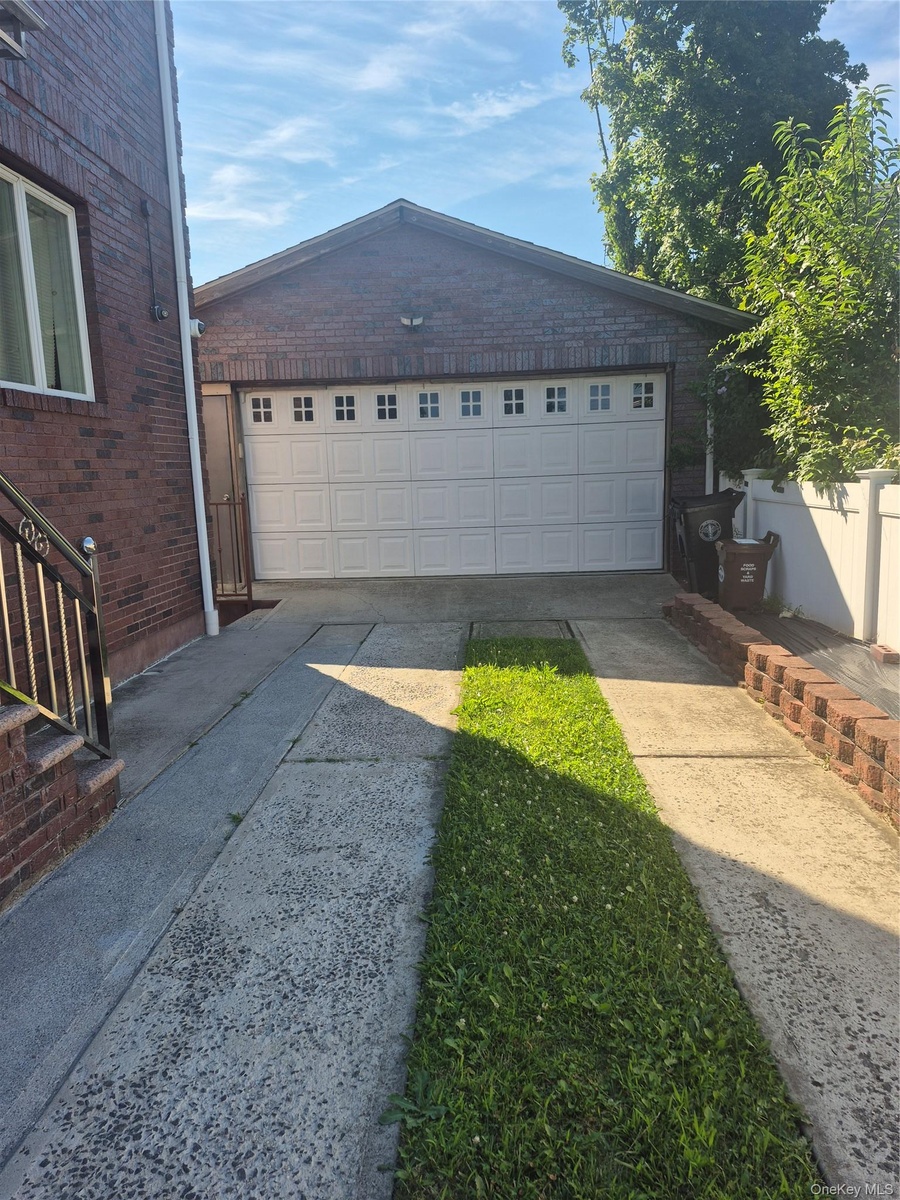Two-car garage with extensive driveway