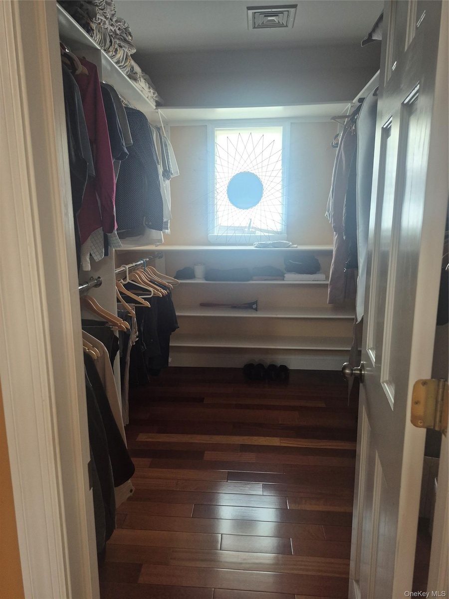 Master Bedroom large walk-in closet with window