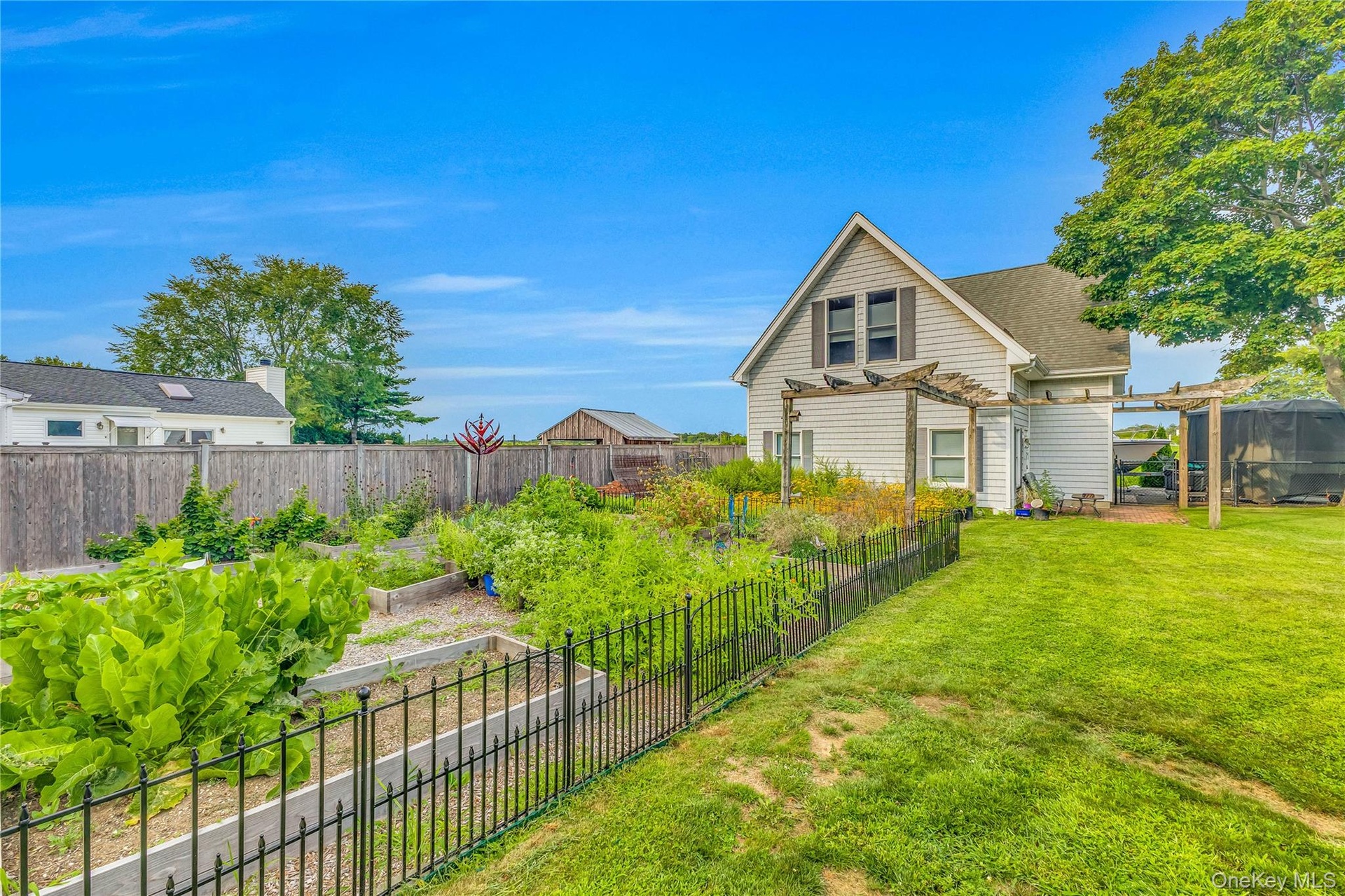 Charming guest cottage garden area for relaxing privacy and charm.