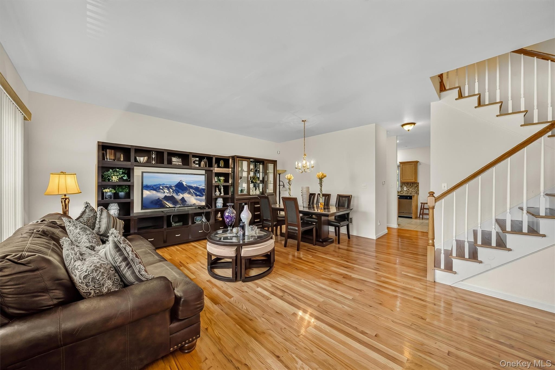 Notice the hardwood floors that run throughout the living area.