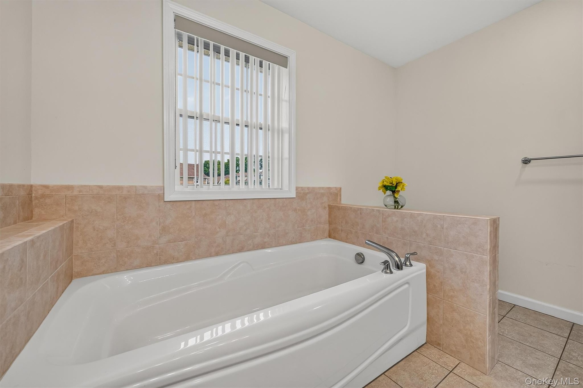 The jetted tub with a window is the perfect way to unwind.