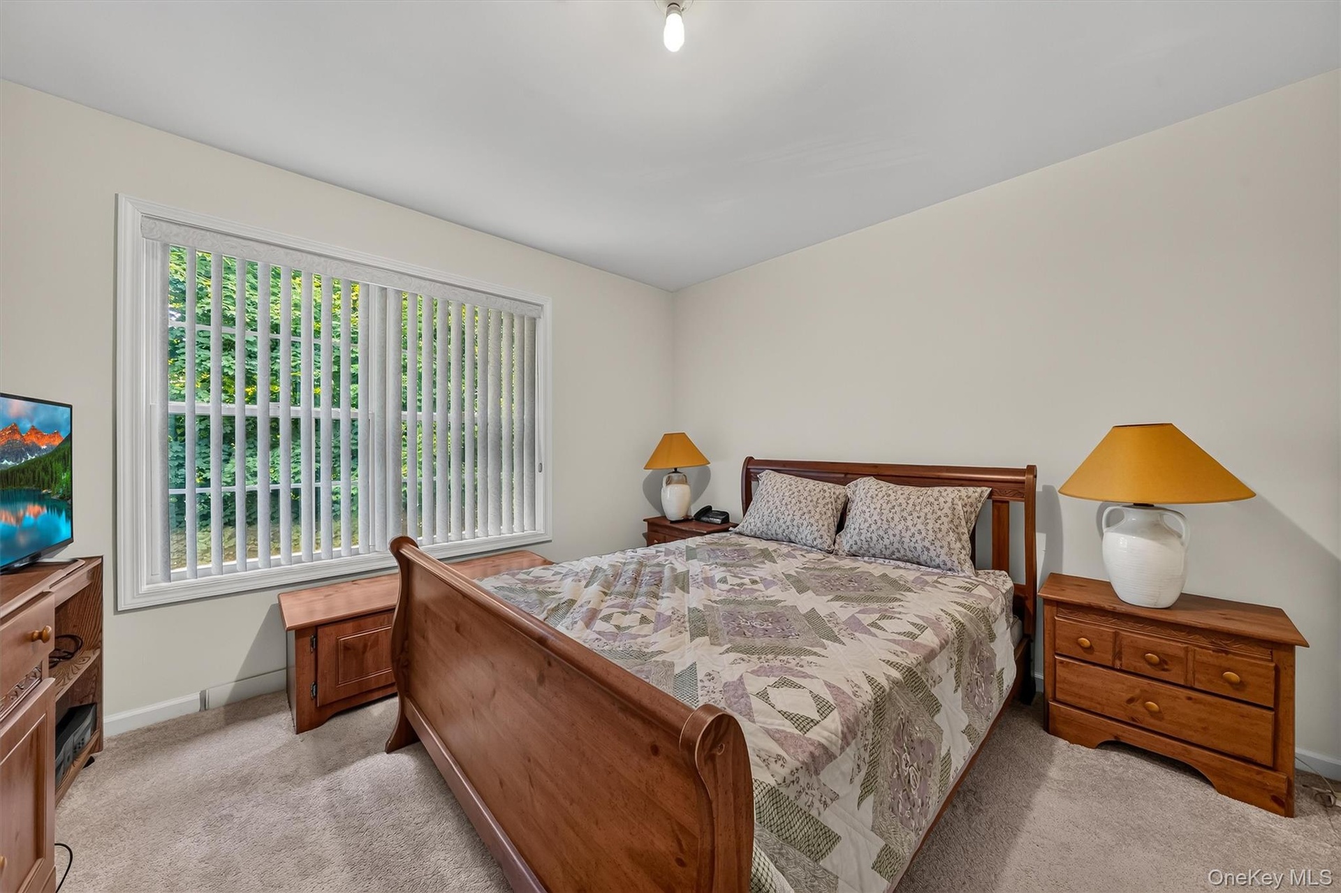The second bedroom is large with another sunny window.