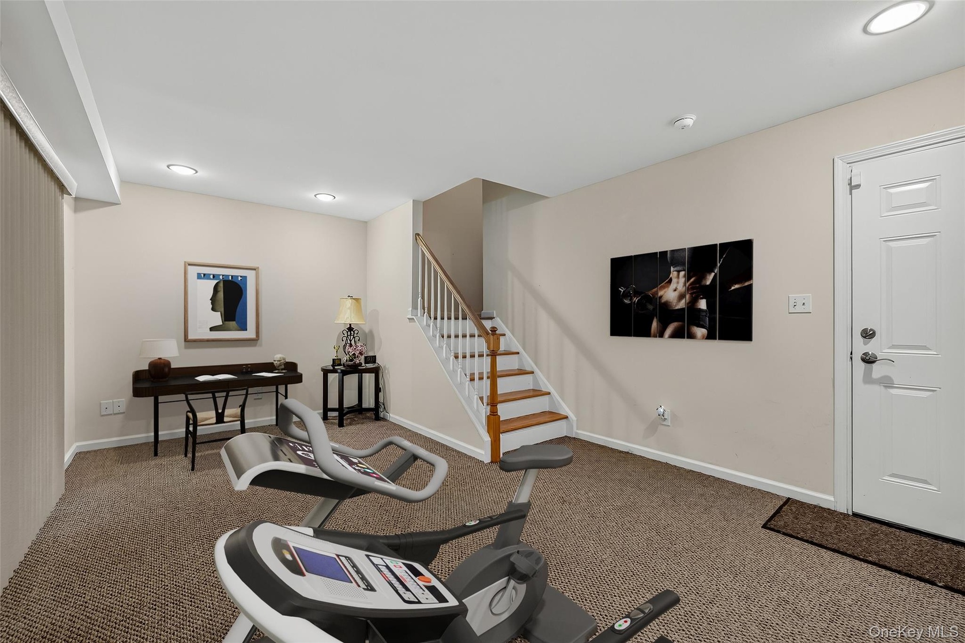 The finished lower level makes a great gym/home office Virtually staged.
