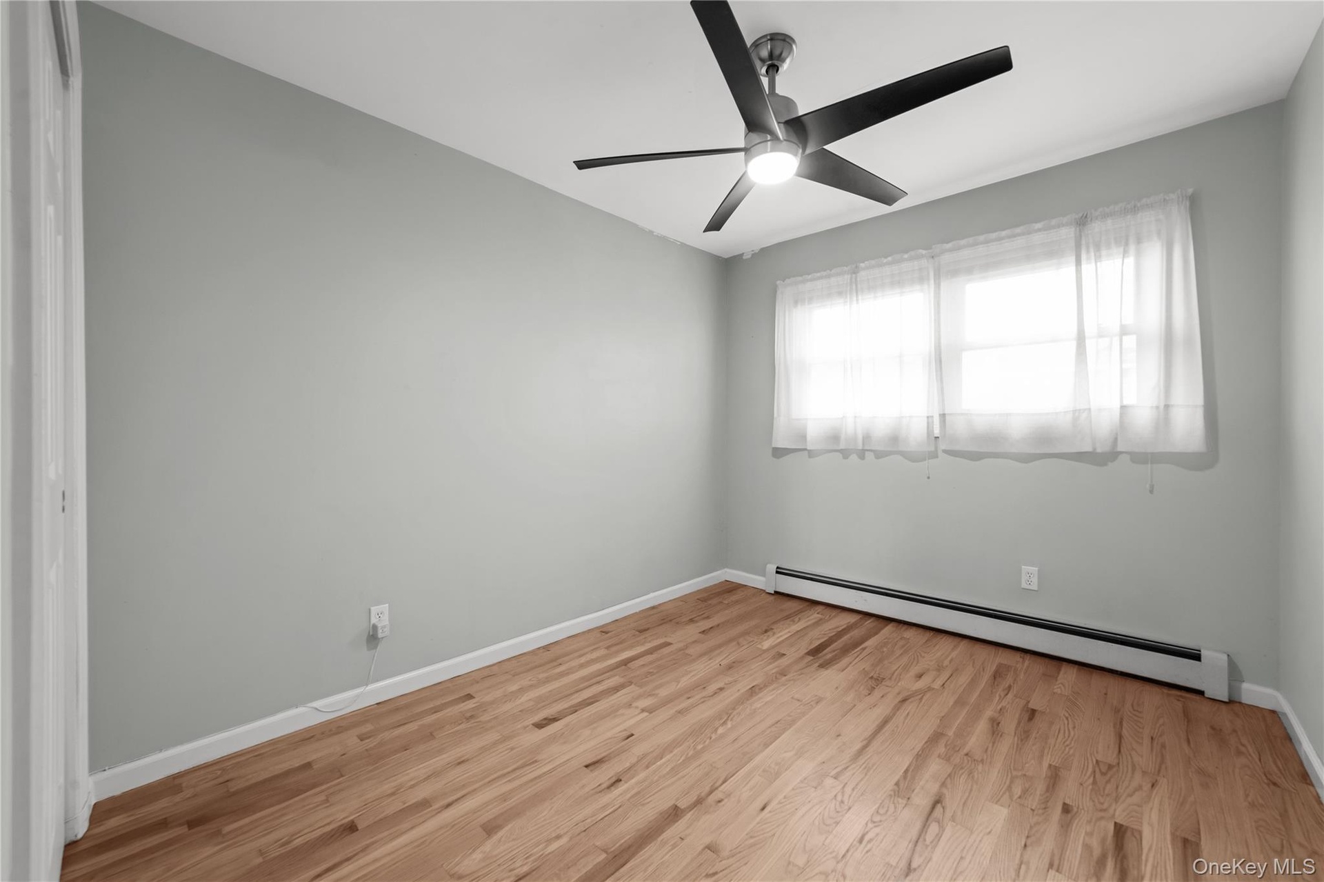 3rd. Bedroom with large window for natural lighting and ceiling fan