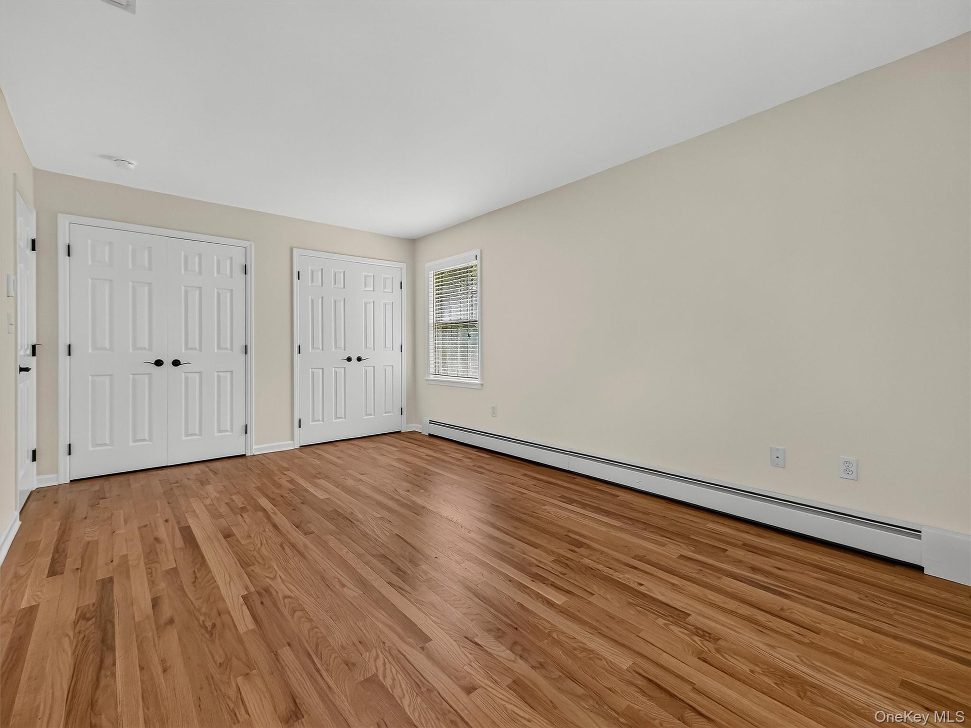 Double closets provide abundant storage without sacrificing the impressive size and versatility of the room.