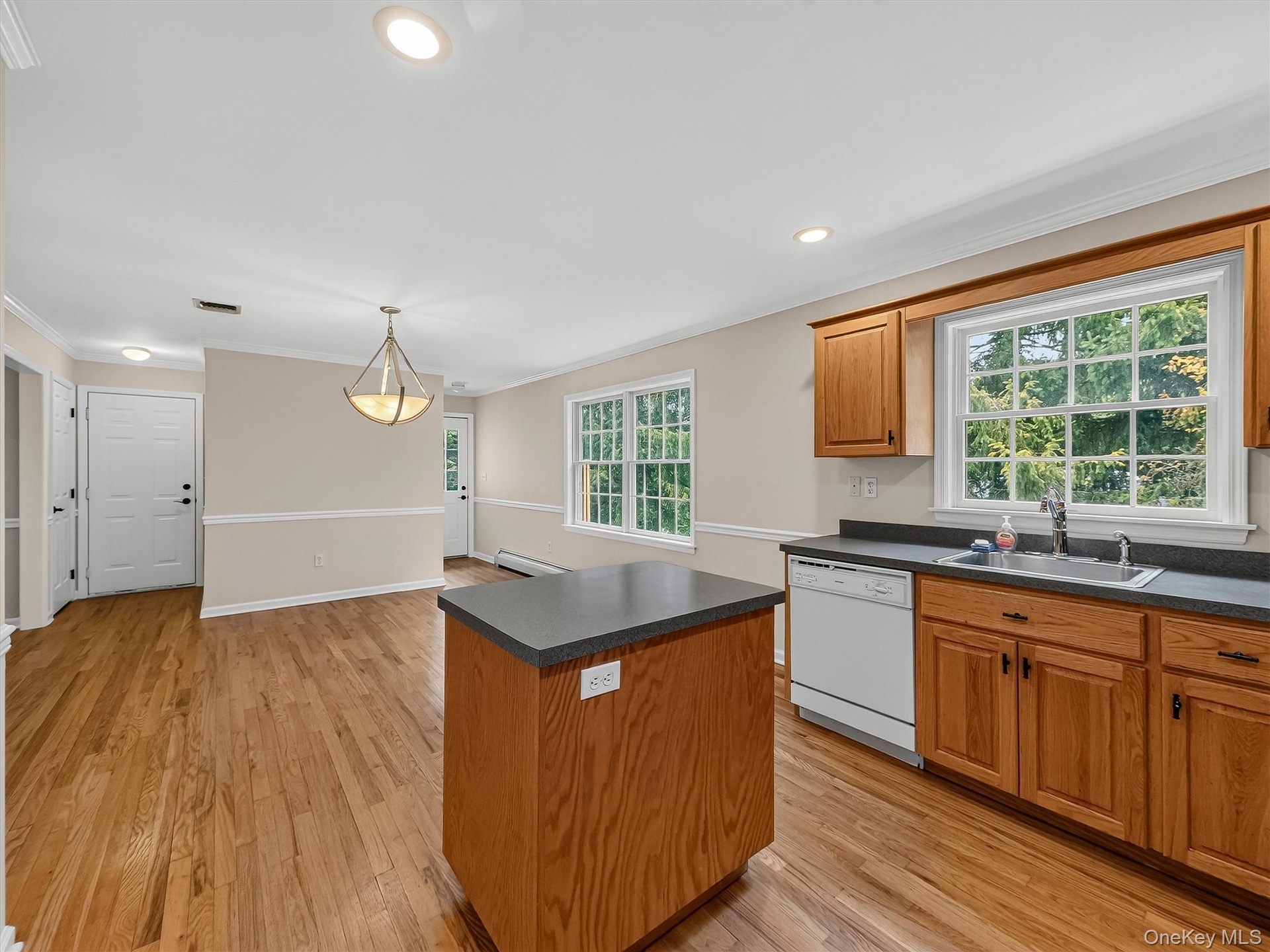Thoughtfully arranged for everyday living, the kitchen opens naturally to the generous dining area, creating a comfortable space for meals, gatherings