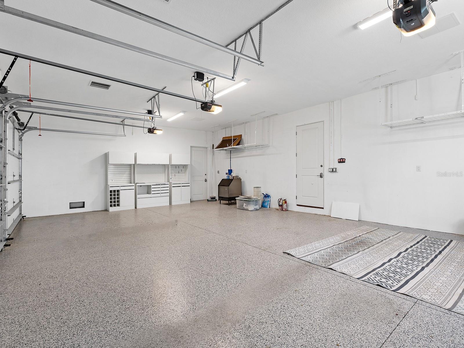 Immaculate garage with epoxy flooring, topped by a spacious, nearly 800-square-foot interior in-law suite complete with a full bathroom