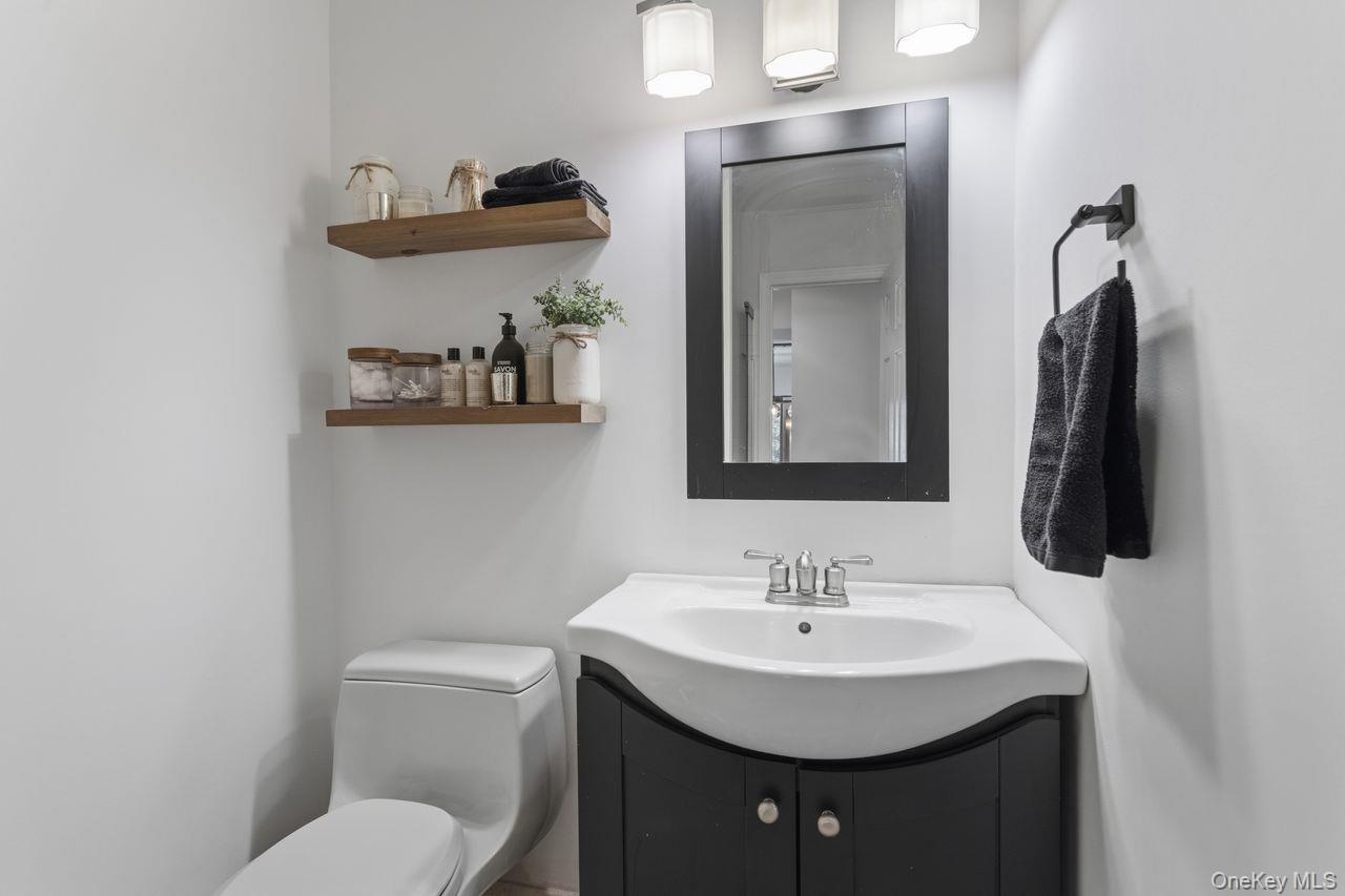 Full hall bathroom with glass enclosed shower