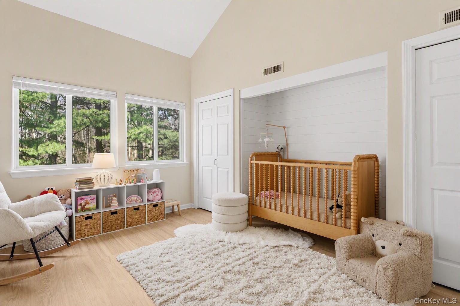 Secondary bedroom with cathedral ceilings.