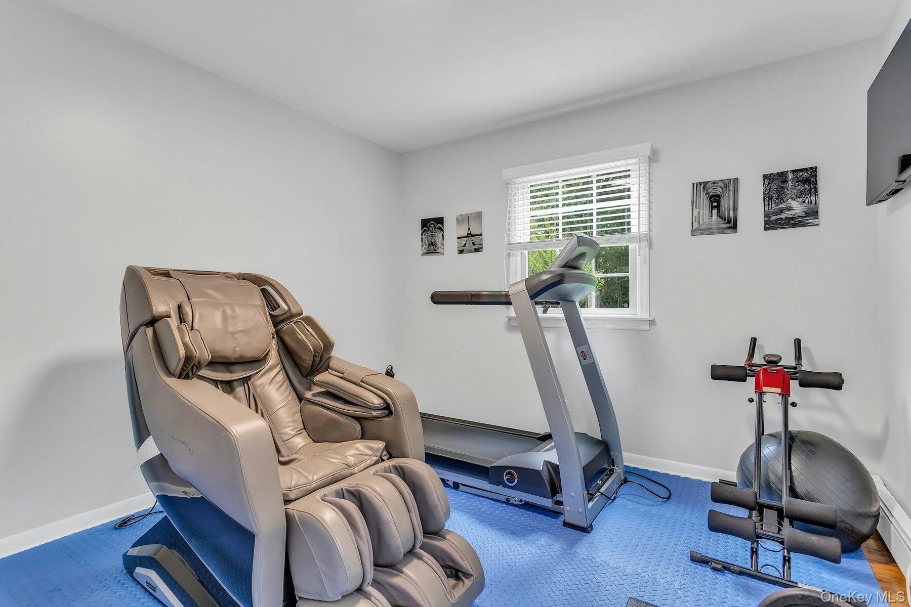 Workout area featuring baseboards