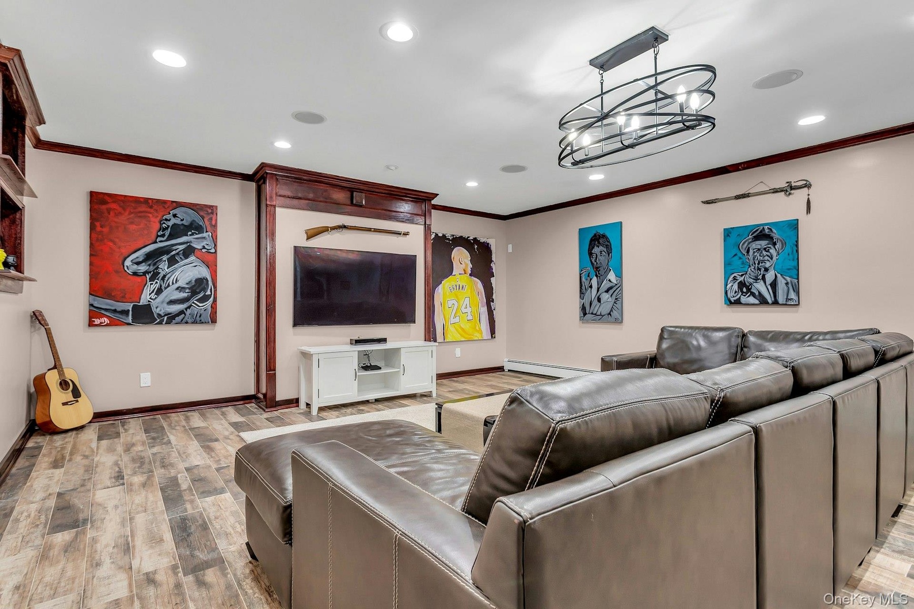 Living room with crown molding, baseboards, light wood-type flooring, recessed lighting, and baseboard heating