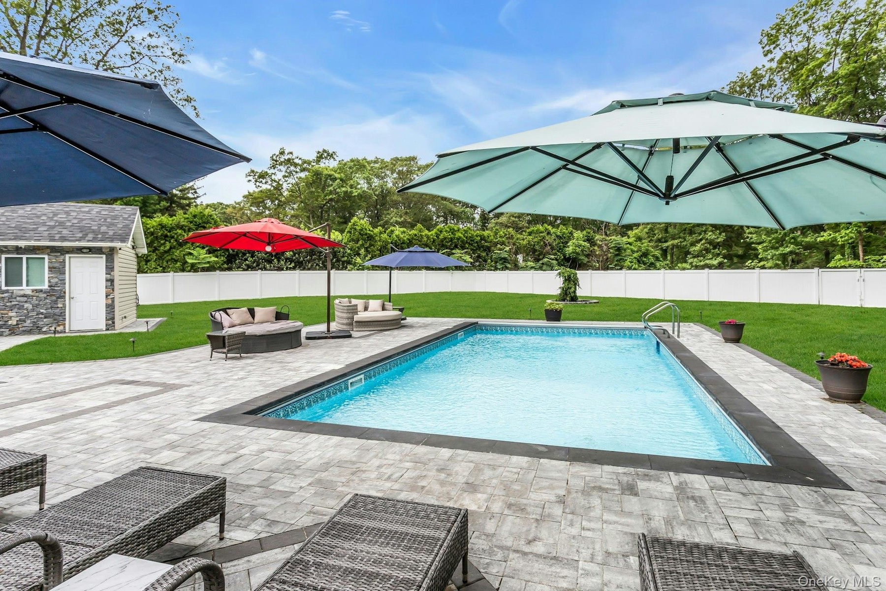 View of swimming pool with a patio, an outdoor structure, and an outdoor living space
