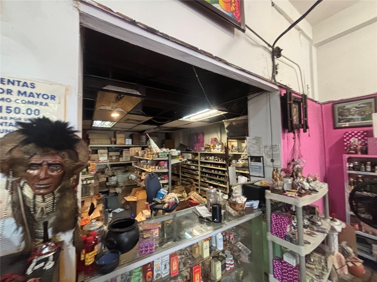 Retail counter divides store from retail inventory area.
