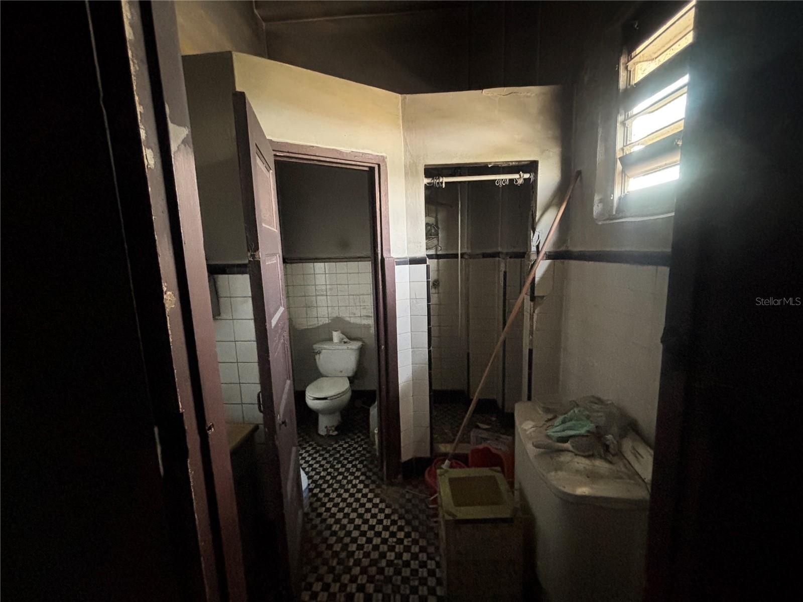 Currently two bathrooms at the back of the retail level.