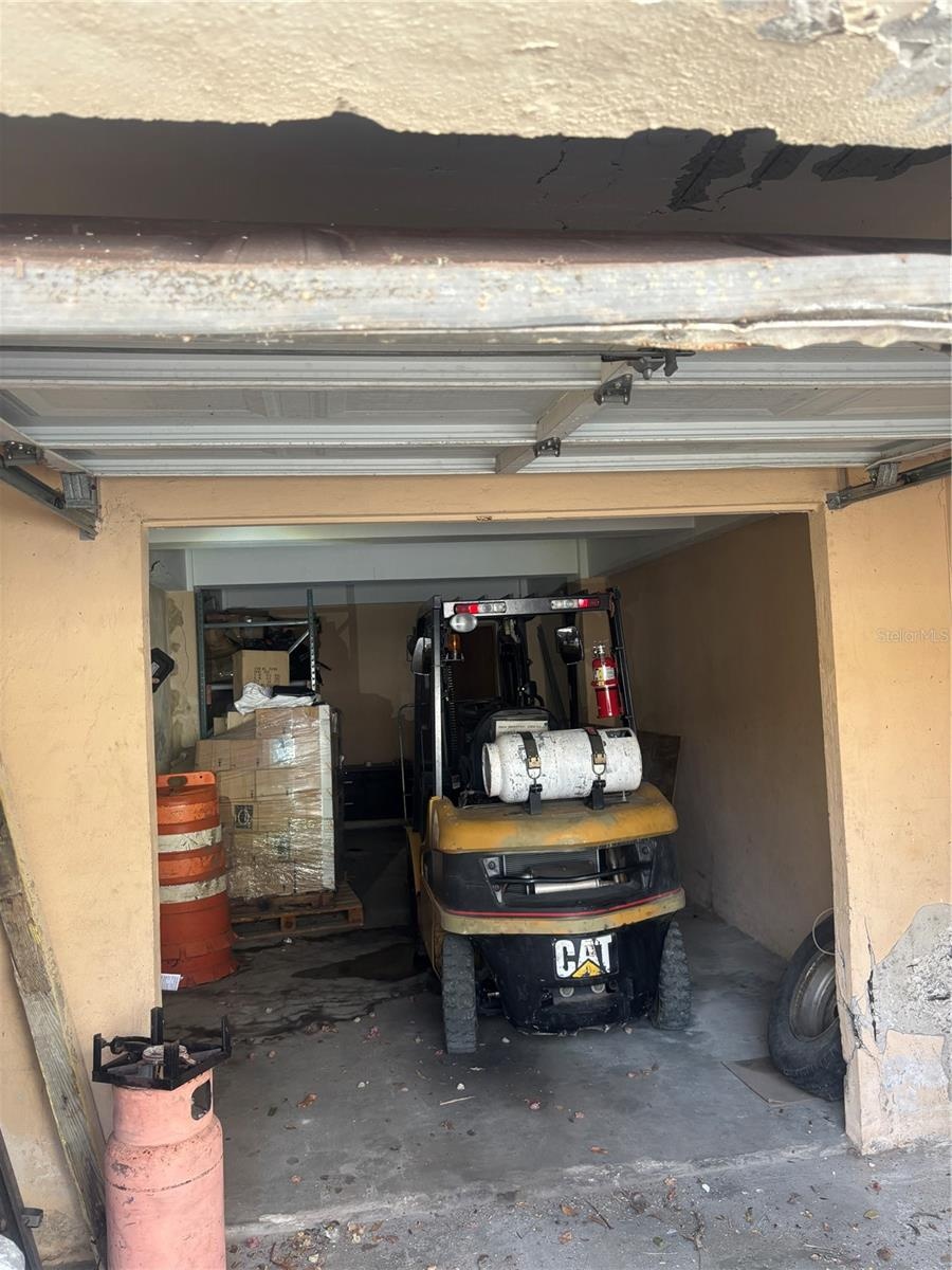 Garage has enough depth for a forklift at the rear and another vehicle.