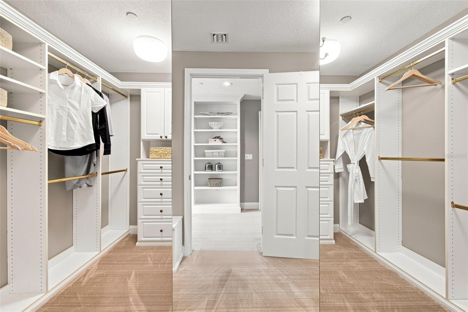 Primary bedroom walk in closet