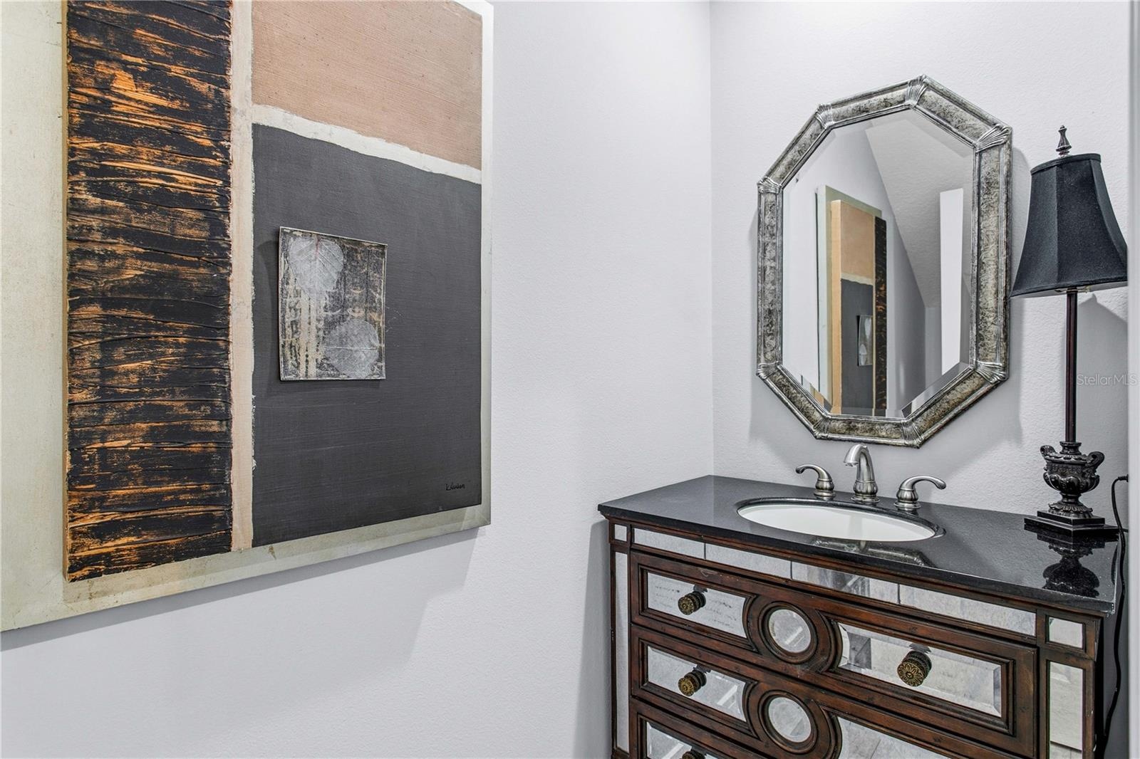 Recent updates to the home include this lovely powder room.