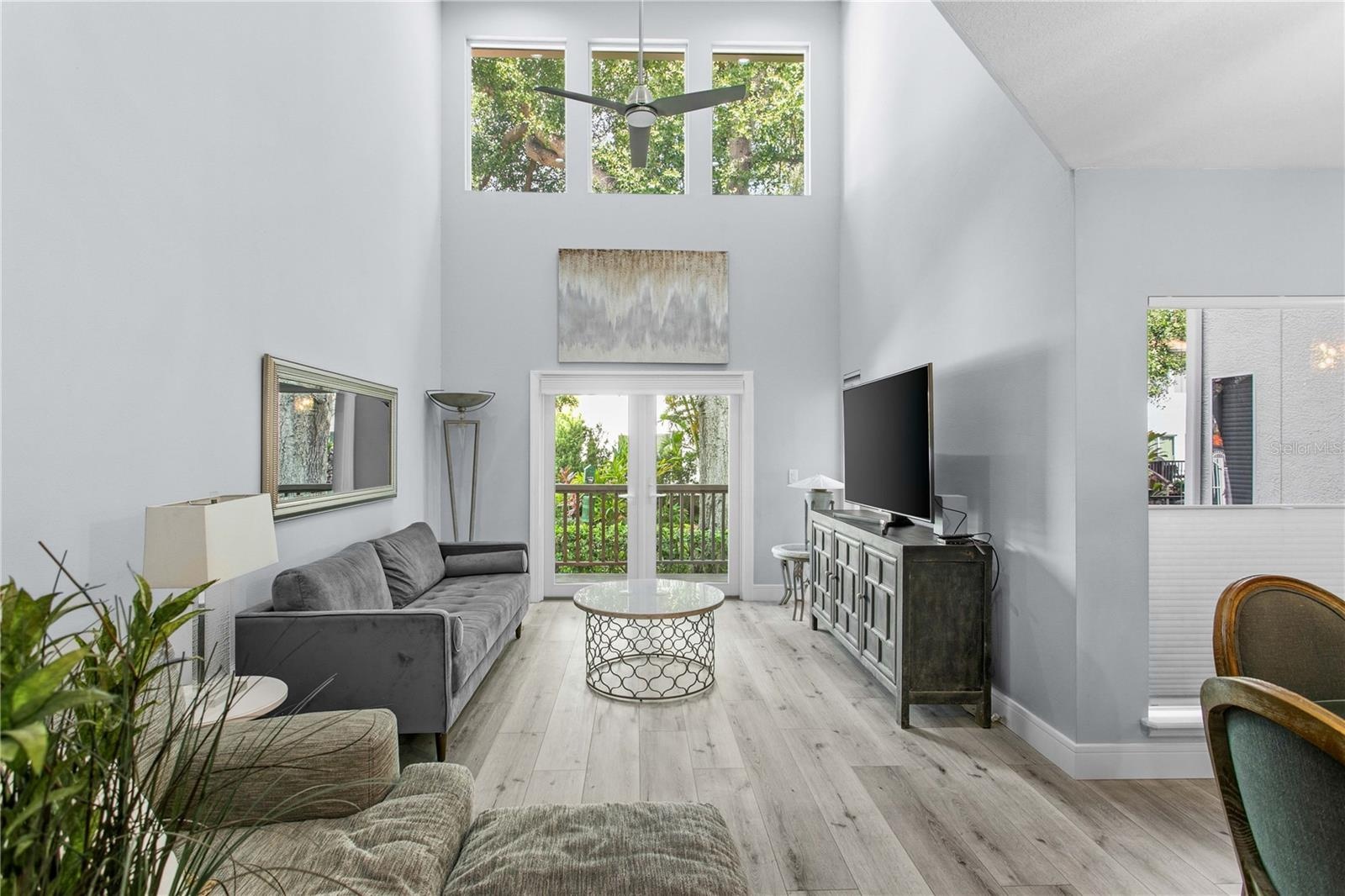 Soaring ceilings set the tone for this bright, open living area.