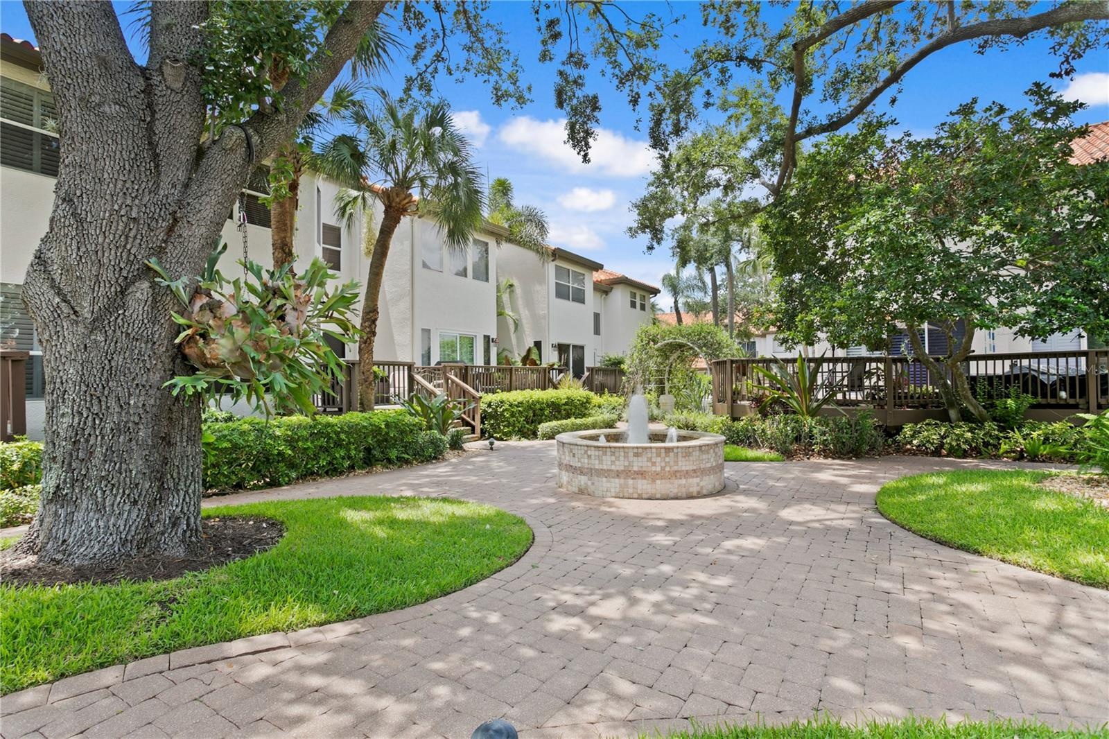 Brick pavers add charm and continuity throughout the community, lining the central courtyard as well as each driveway and front walkway.