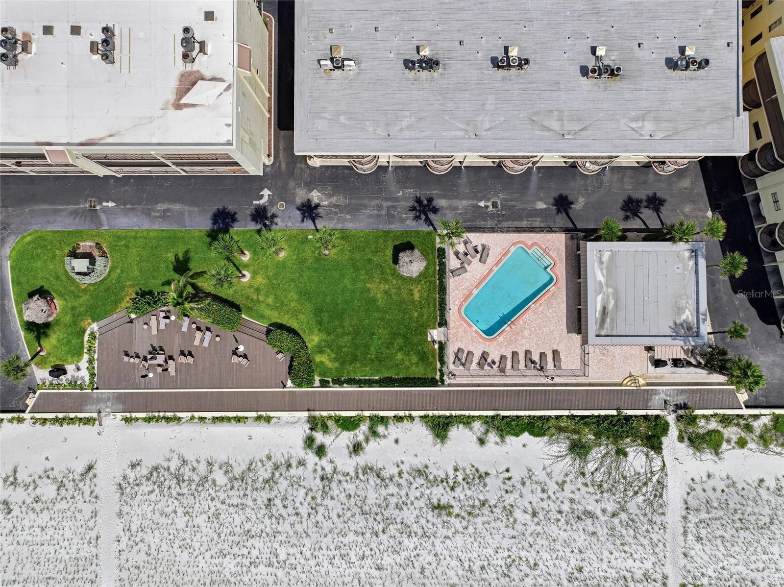 Aerial top-down view of complex with pool