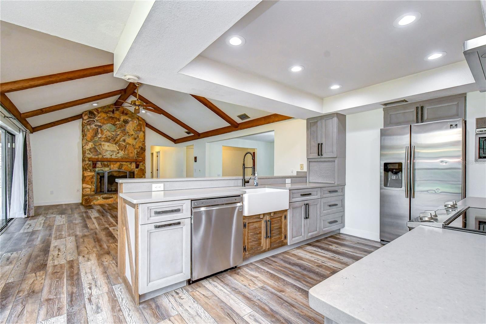 Open-concept design keeps the kitchen connected to the main gathering spaces