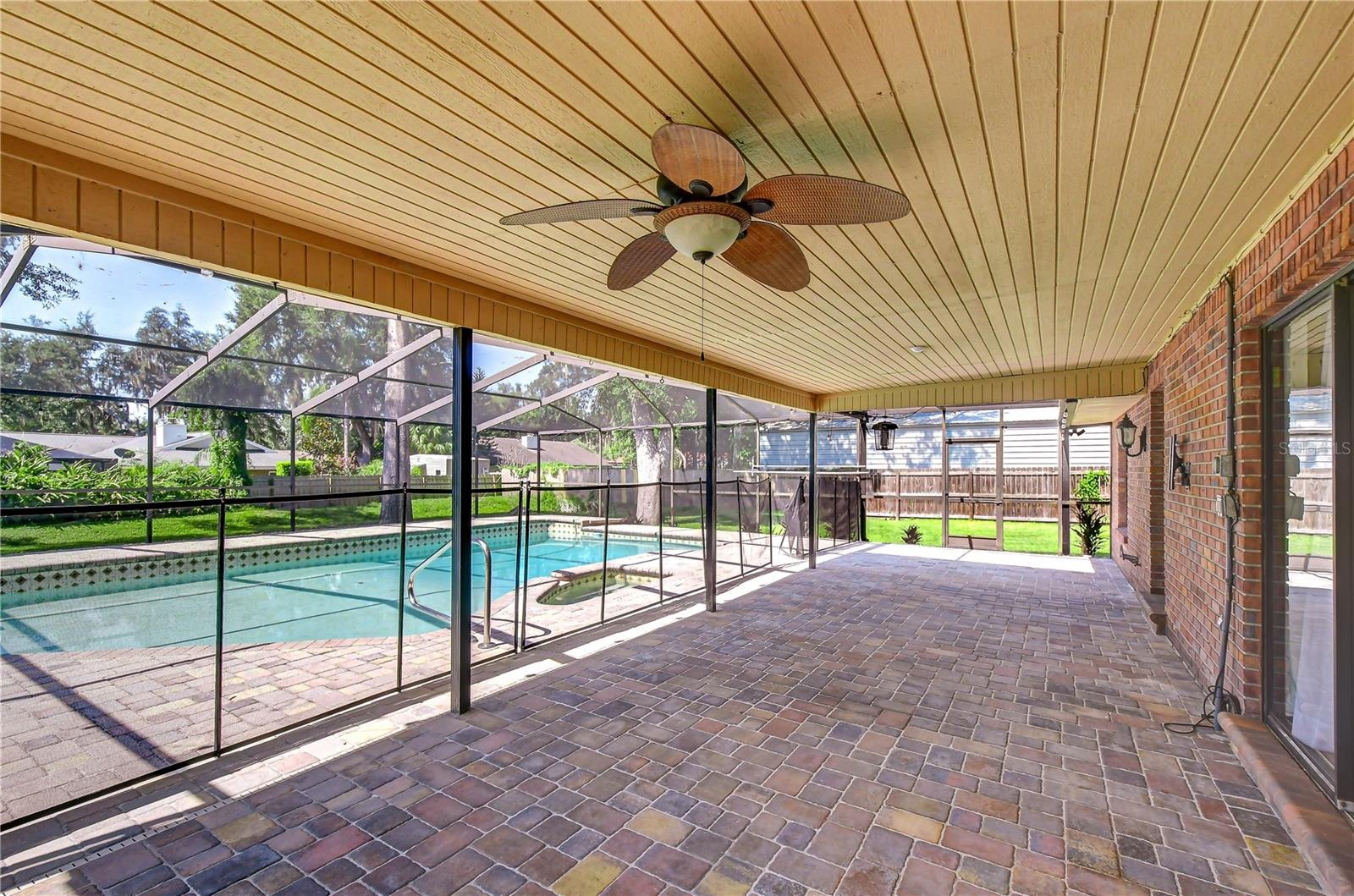Pavered lanai and pool area provide an attractive entertaining space