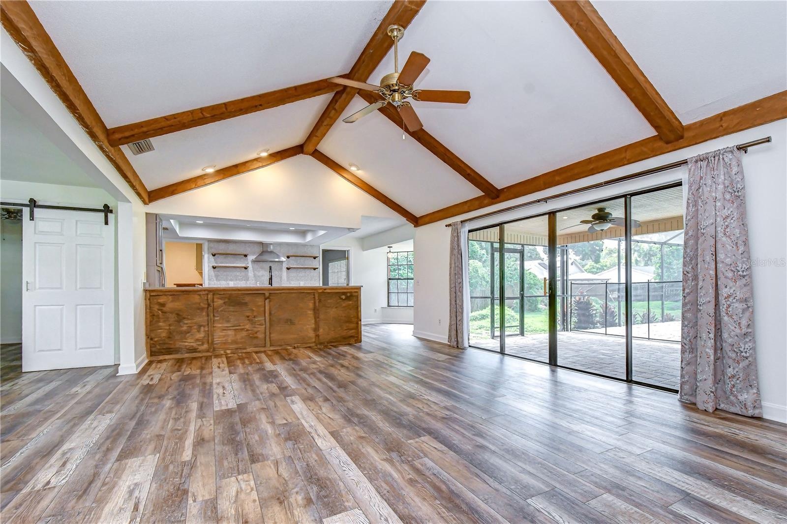 Updated flooring flows throughout the main living areas for a cohesive look